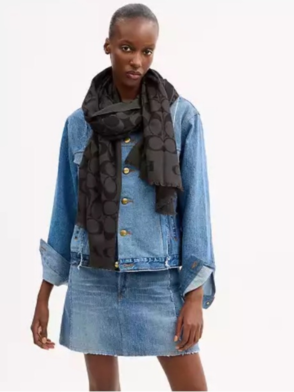 Coach Signature Wrap  made from a wool and silk blend with a tonal jacquard logo